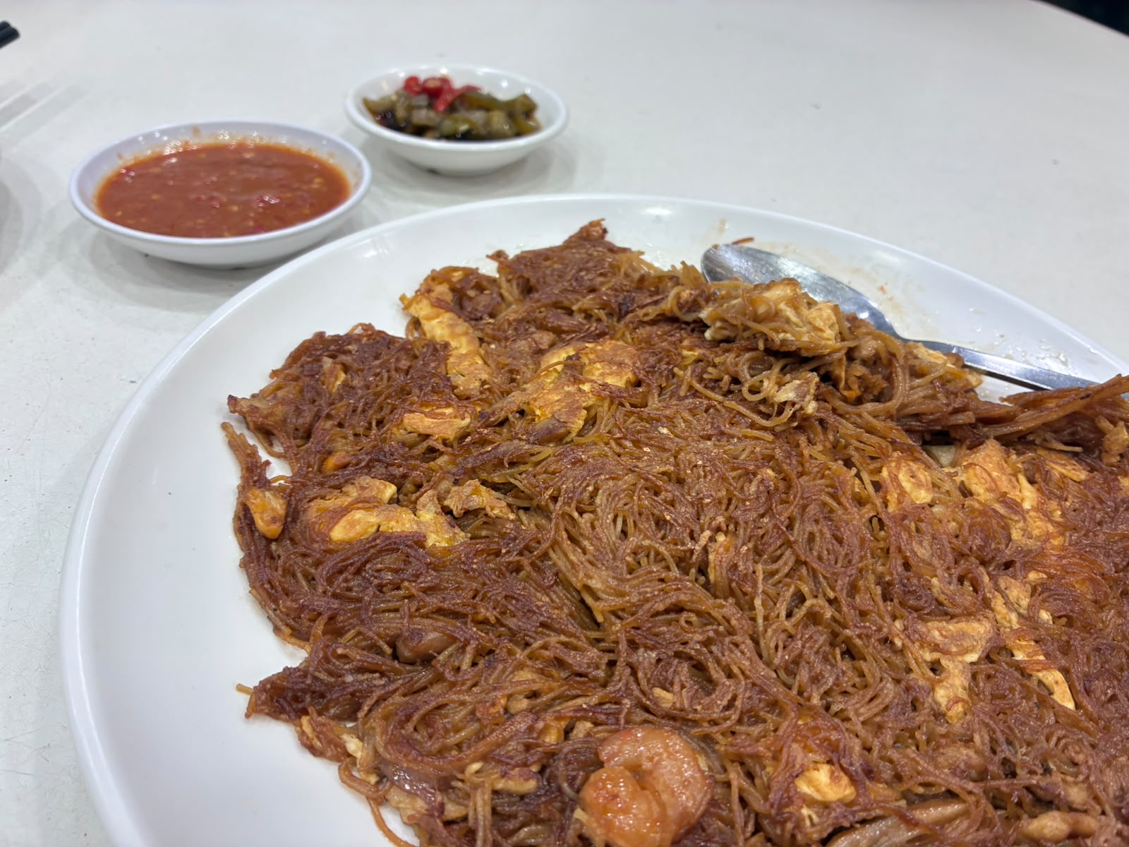 Red chilli sauce and pickled green chilli served with fried bee hoon