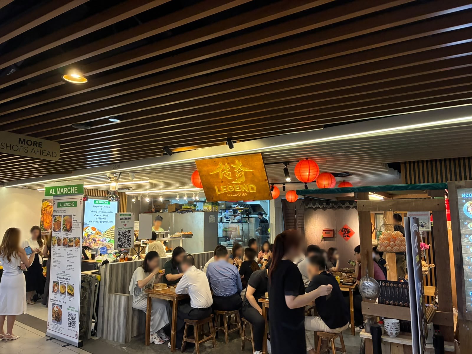 Al Marche and Legend Specialties stalls with lunch crowd at The Basement, Singapore (faces blurred)