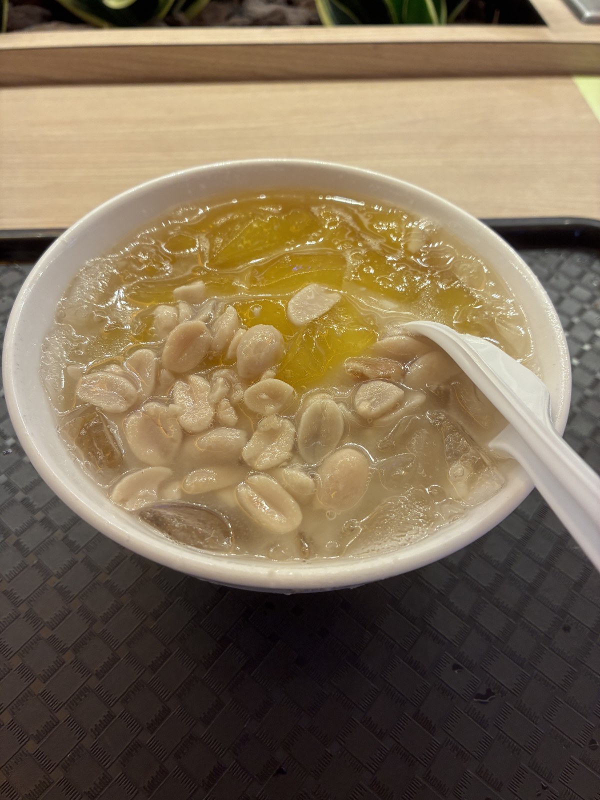 Taiwanese tofu pudding douhua topped with boiled peanuts at Taoyuan International Airport