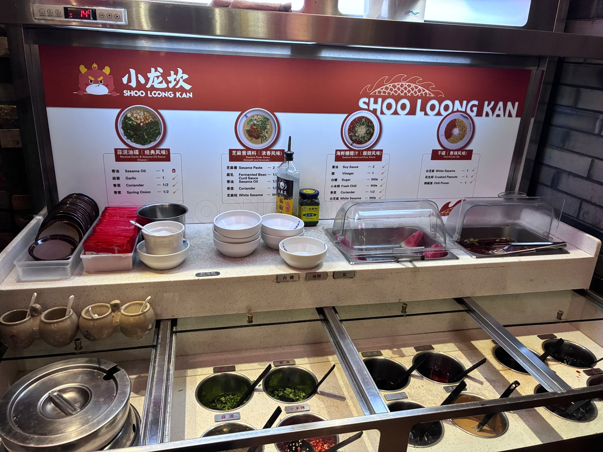 Self-service sauce bar with recipe cards at Shoo Loong Kan hotpot, Singapore