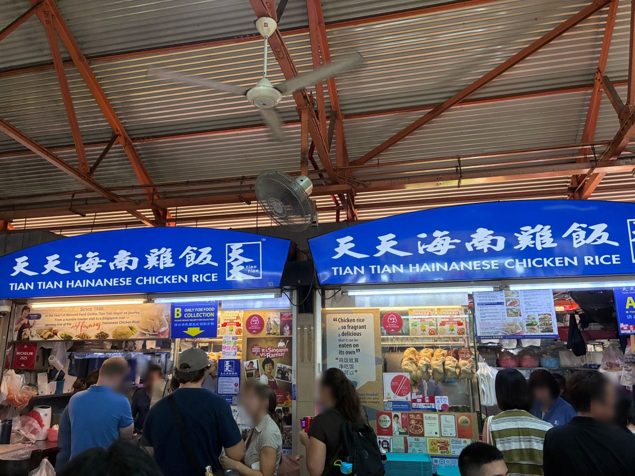 Tian Tian Hainanese Chicken Rice stall at Maxwell Food Centre with a lunch queue (faces blurred)