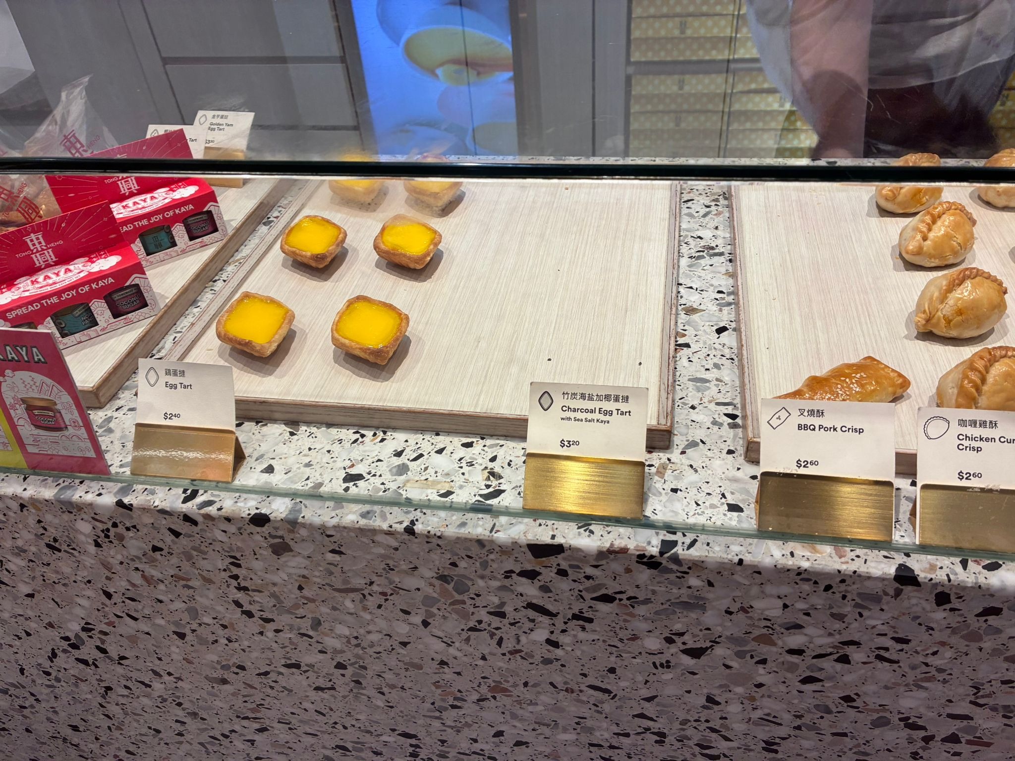 Diamond-shaped egg tarts in the display case at Tong Heng, Chinatown Singapore