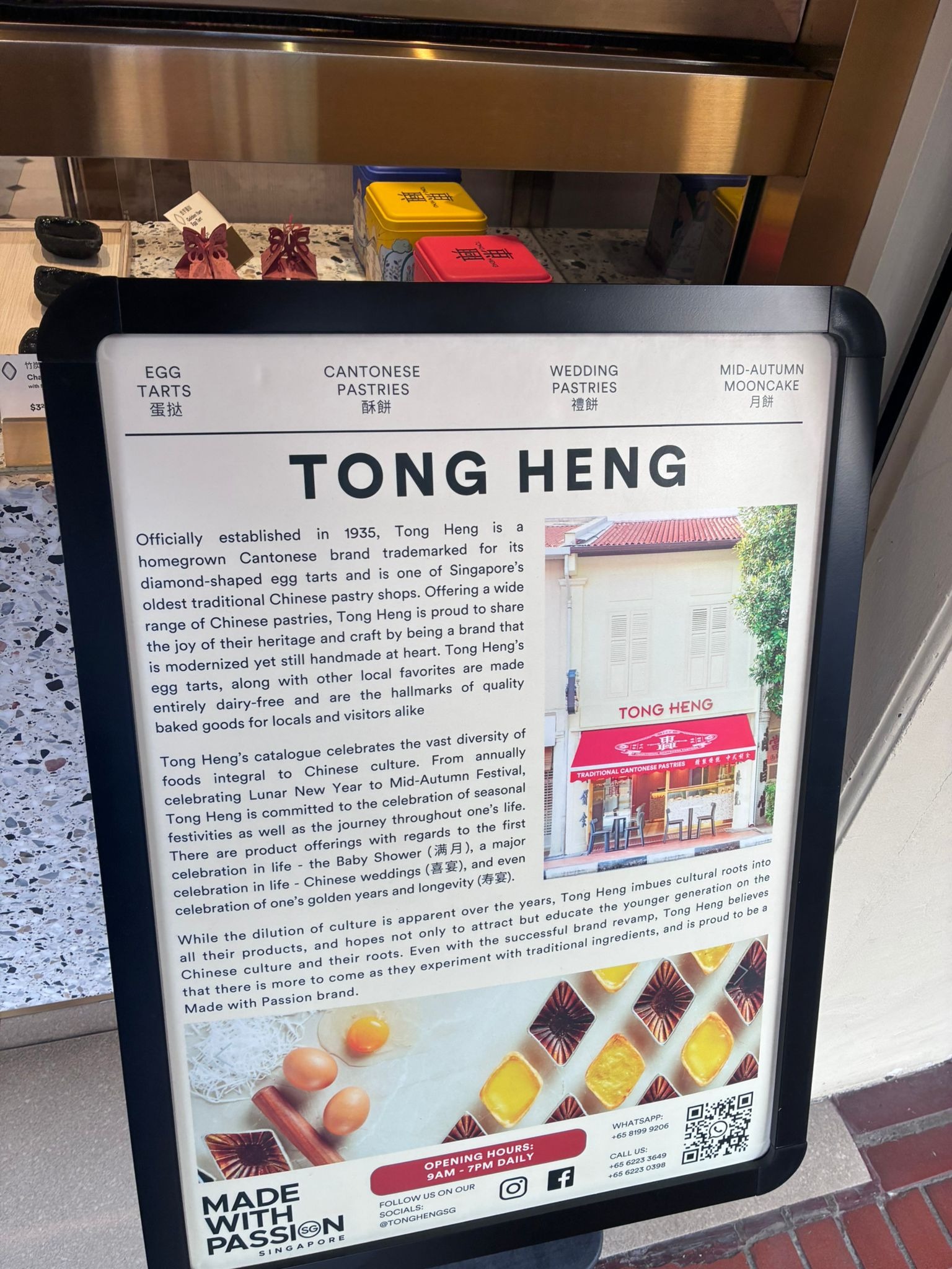 Signboard telling the history of Tong Heng, established 1935 in Singapore