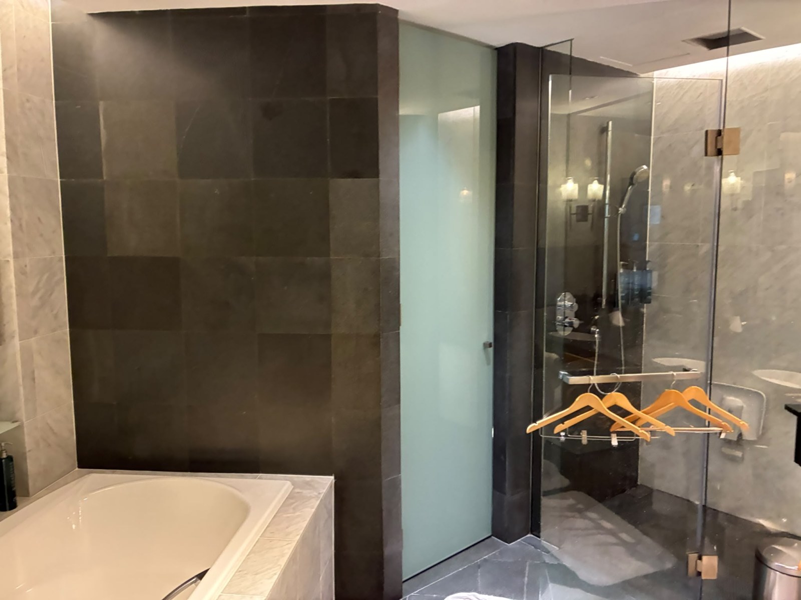 Bathroom of a Grand Executive Suite at Hilton Kuala Lumpur with separate bathtub and walk-in shower, Malaysia