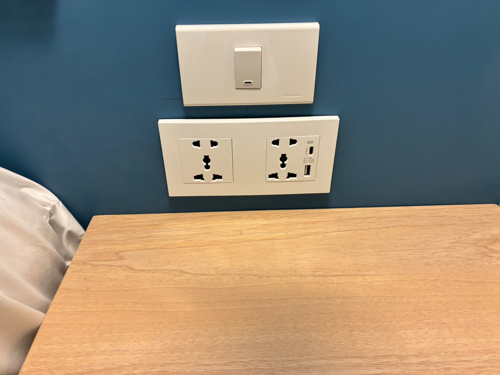 Bedside universal power socket with USB port at Katathani Phuket Beach Resort, Thailand