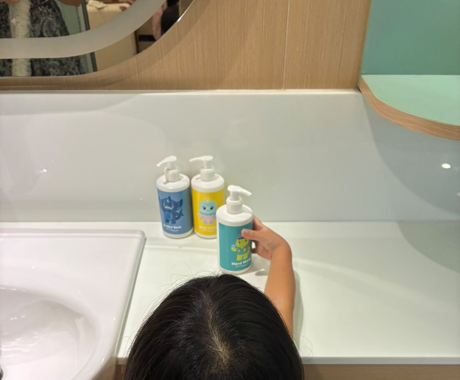 Children's shampoo and body wash amenities on the washbasin at Katathani Phuket Beach Resort, Thailand
