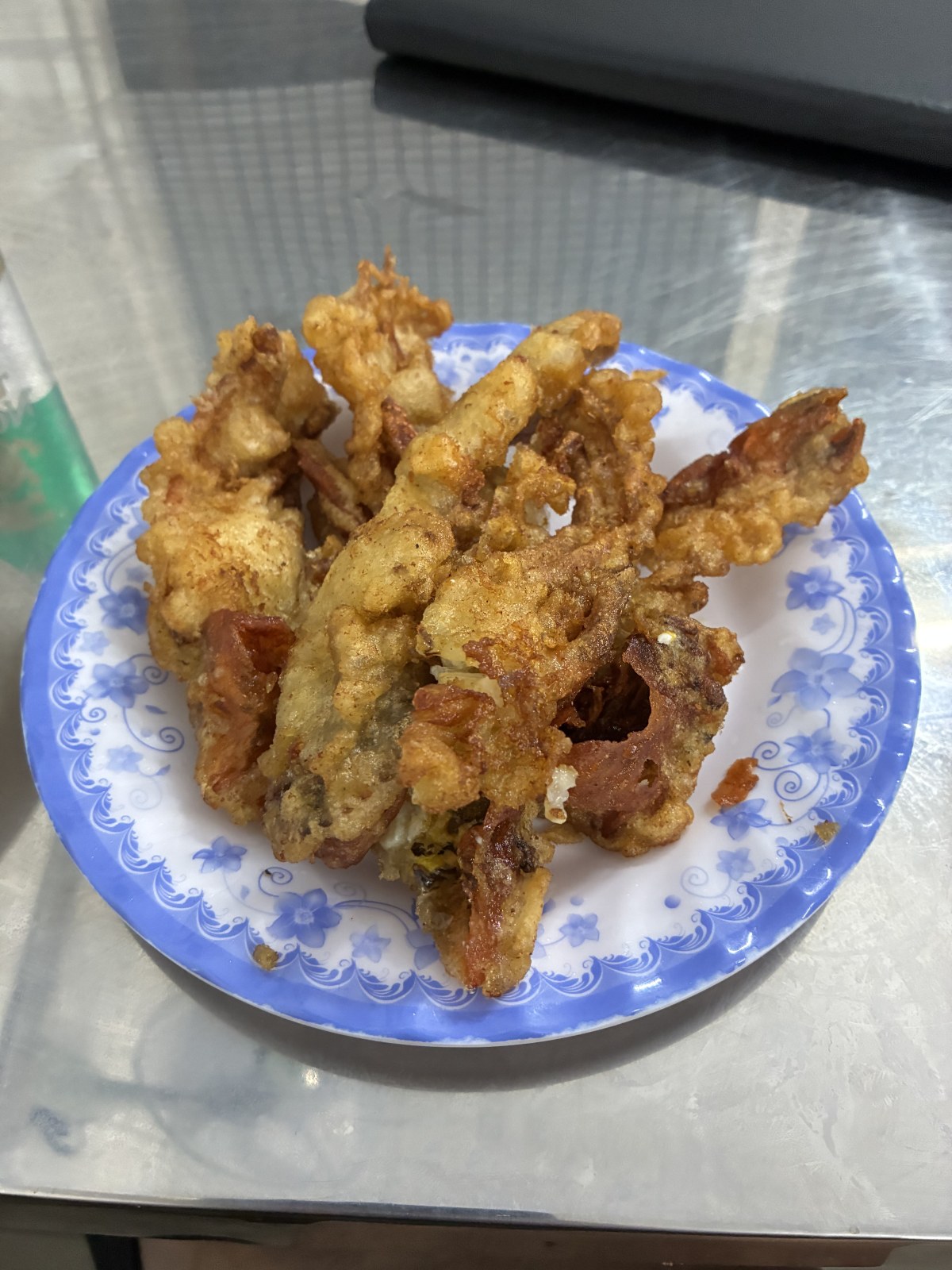 Deep-fried soft shell crab on a blue and white plate at Quan 94, Ho Chi Minh City, Vietnam