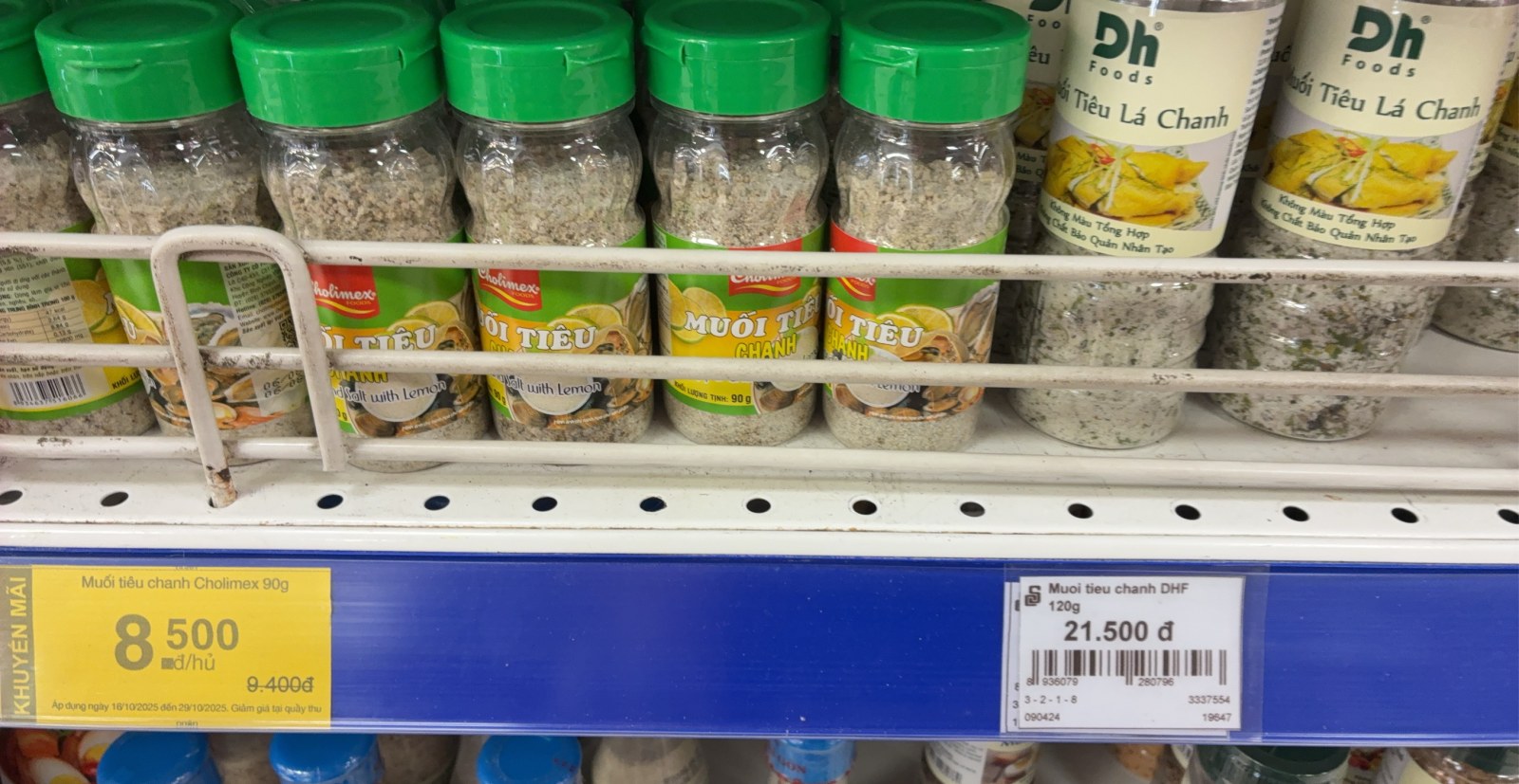Vietnamese salt, pepper and lime seasoning jars on a supermarket shelf in Ho Chi Minh City
