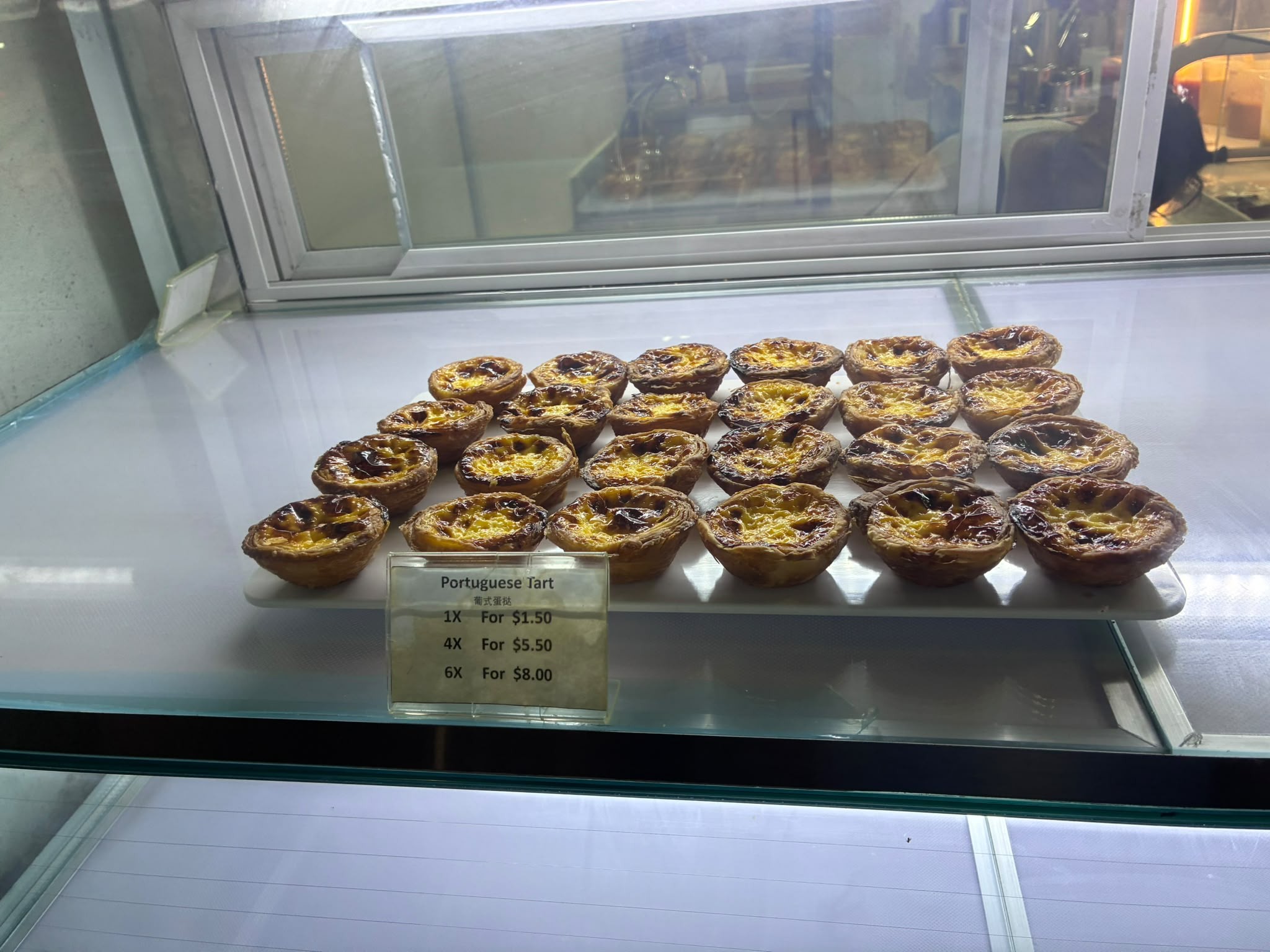 Shopfront of 50 Years Taste of Tradition bakery in Chinatown Singapore at night