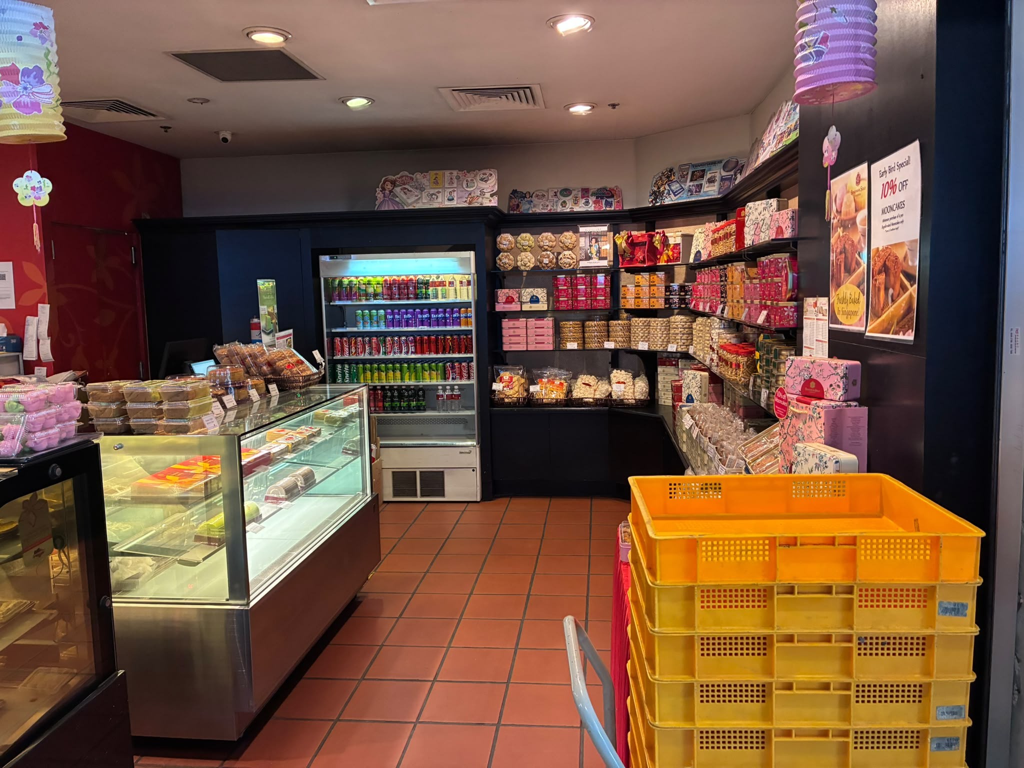 Inside a Bengawan Solo shop with cookie tins and mooncake promotion