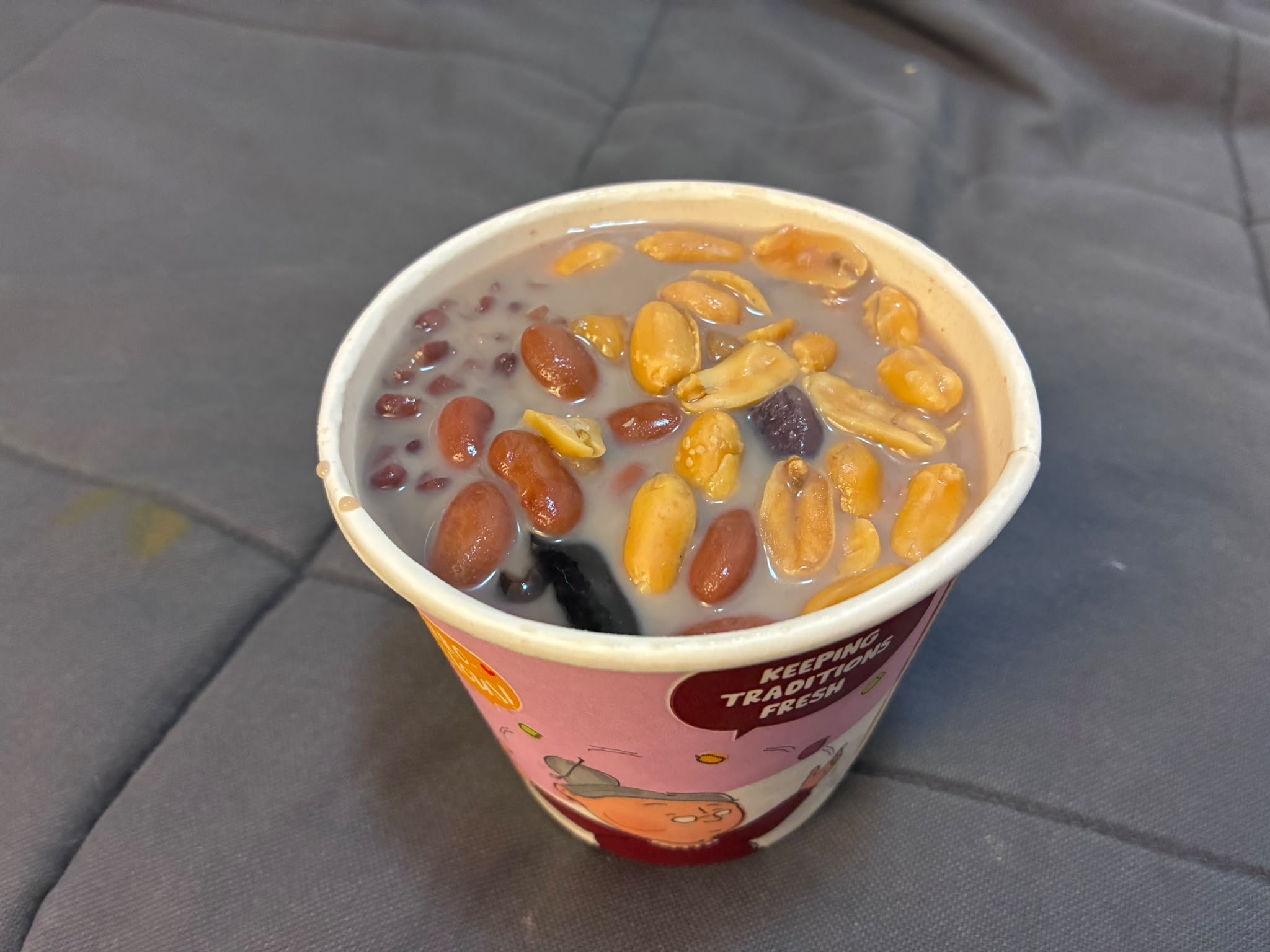 Nine Fresh Signature douhua cup with beans, roasted peanuts and taro balls