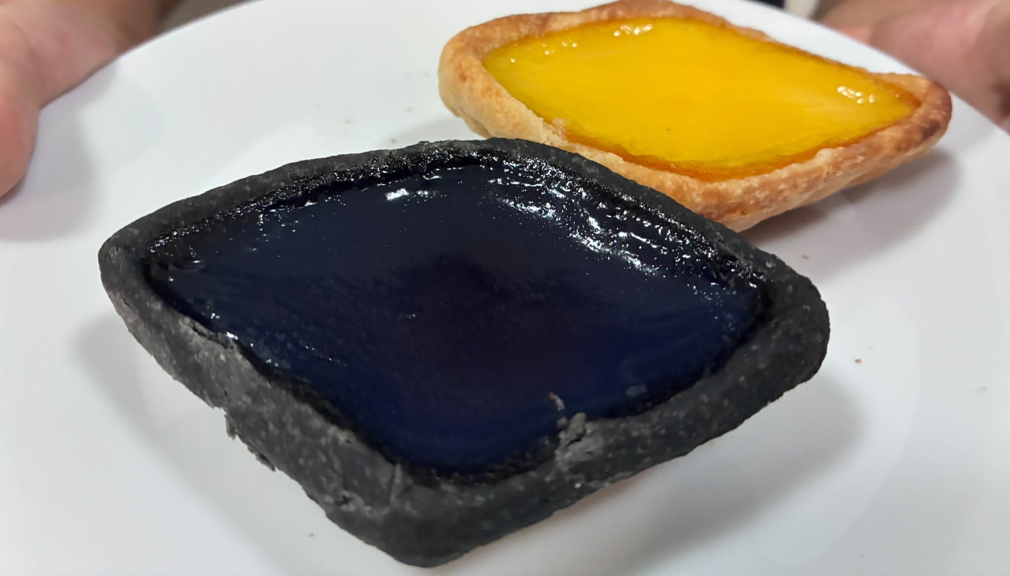 Charcoal and classic diamond-shaped egg tarts from Tong Heng, Chinatown Singapore